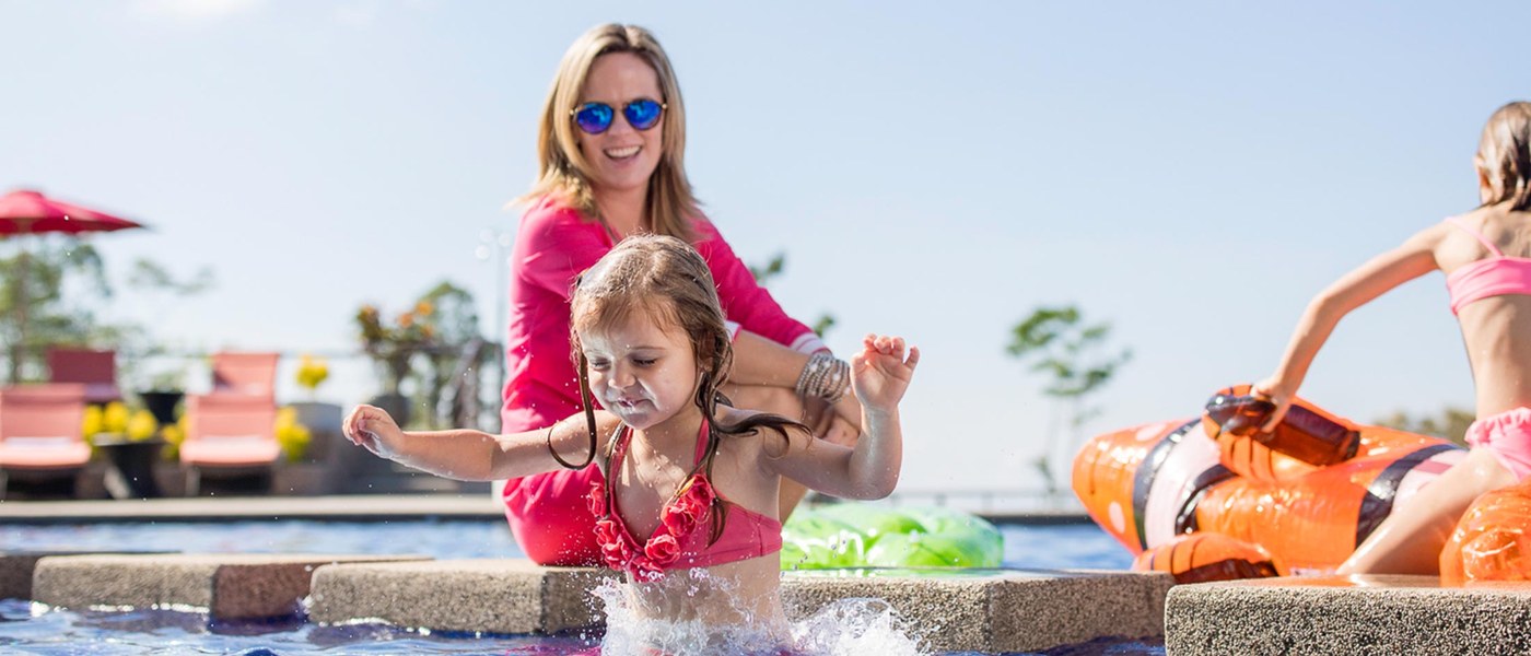 Happy family enjoying pool time in Costa Rica