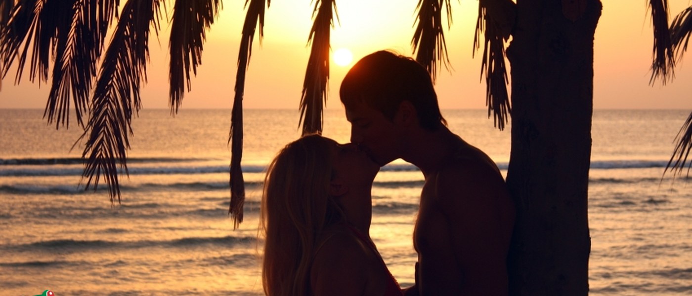 Couple kissing at sunset on Costa Rica beach