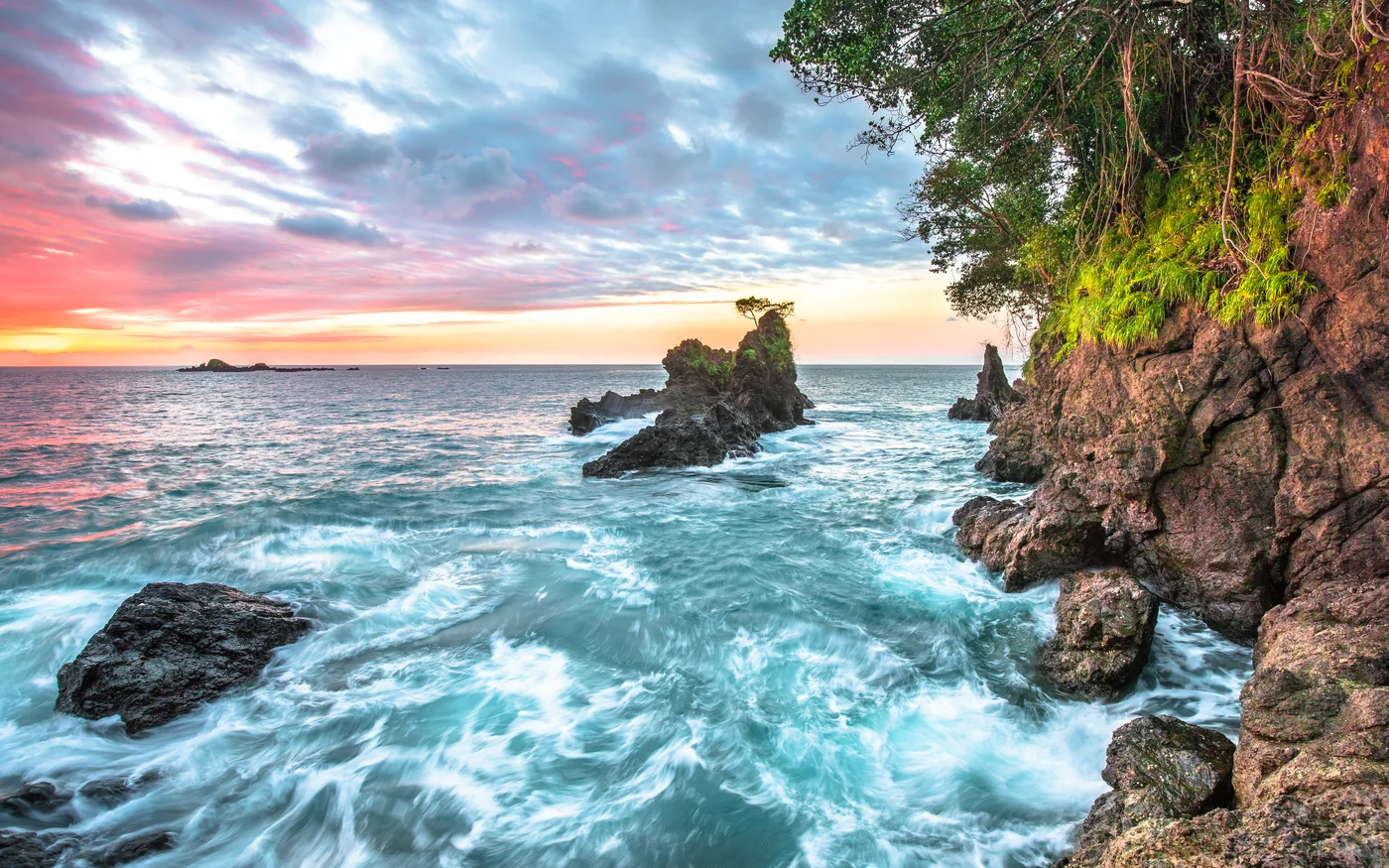 Dramatic sunset over a rocky Pacific coastline, Costa Rica